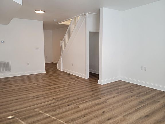 storage under stairs in living/dining area