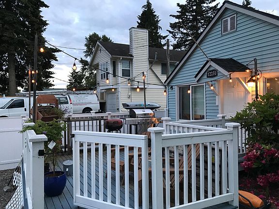 Deck has gate into the lawn and garden