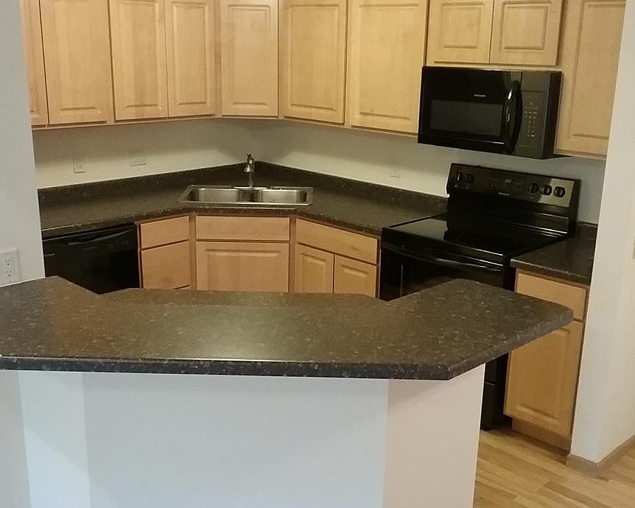 Island kitchen with remodeled countertops and cabinets