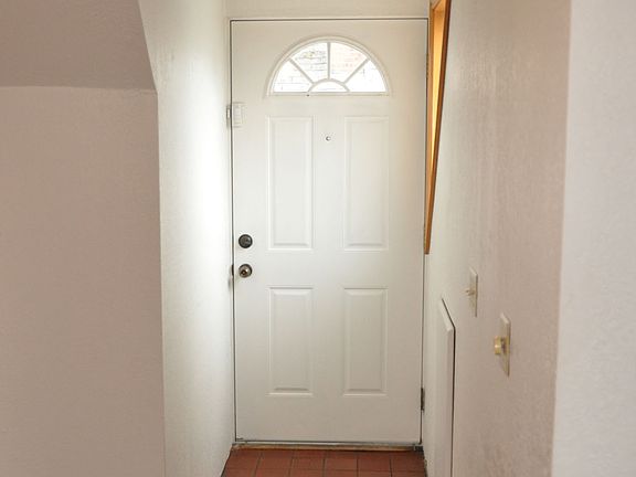 View to entry door from dining area