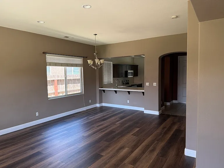 View from Living Room to kitchen and foyer.