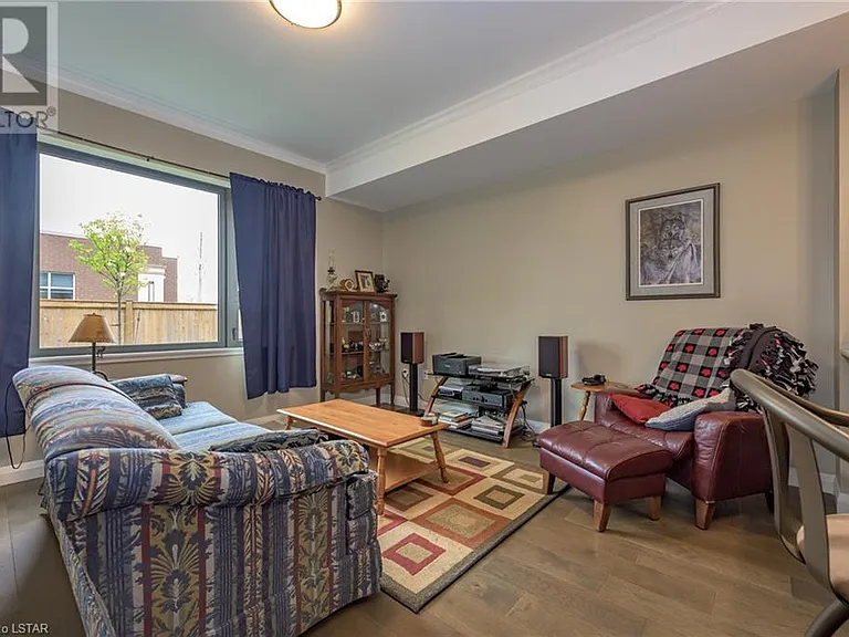 Large window in living room invites lots of natural light.