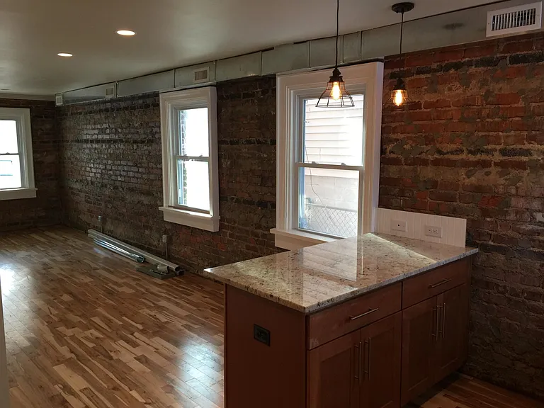 Granite tops. Exposed brick