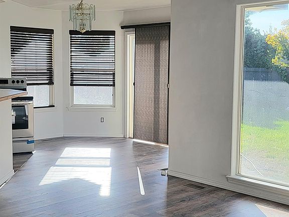 New Flooring, Open Concept Livingroom, Dining, Kitchen. Abundance of natural light.