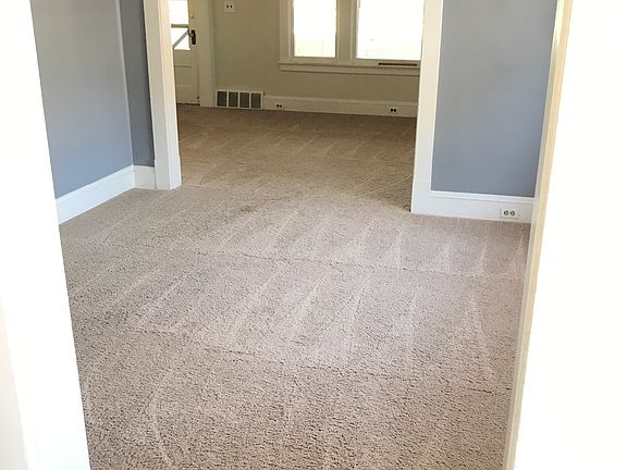 From Kitchen through to Dining Room to Living Room