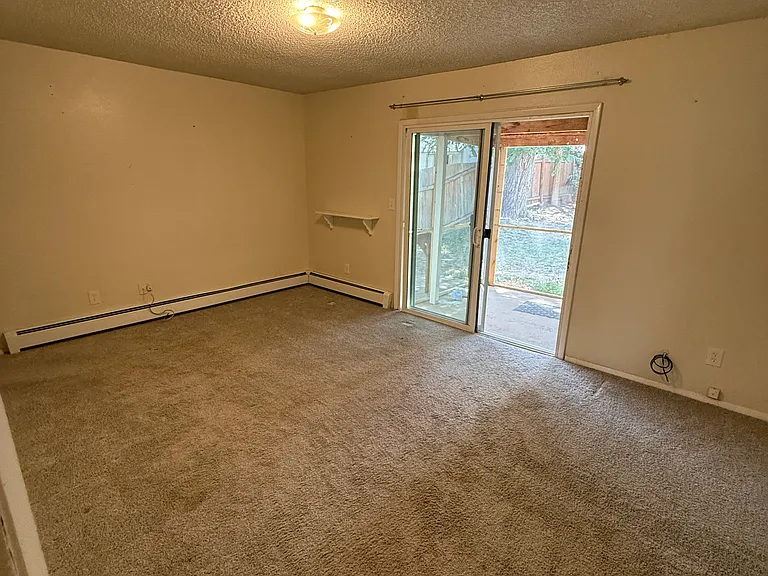 Master Bedroom with attached bathroom. Walks out to fenced yard, has private access from side & its own screened in patio.
