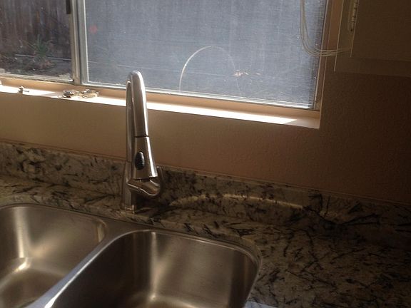 Kitchen sink with window to back yard.