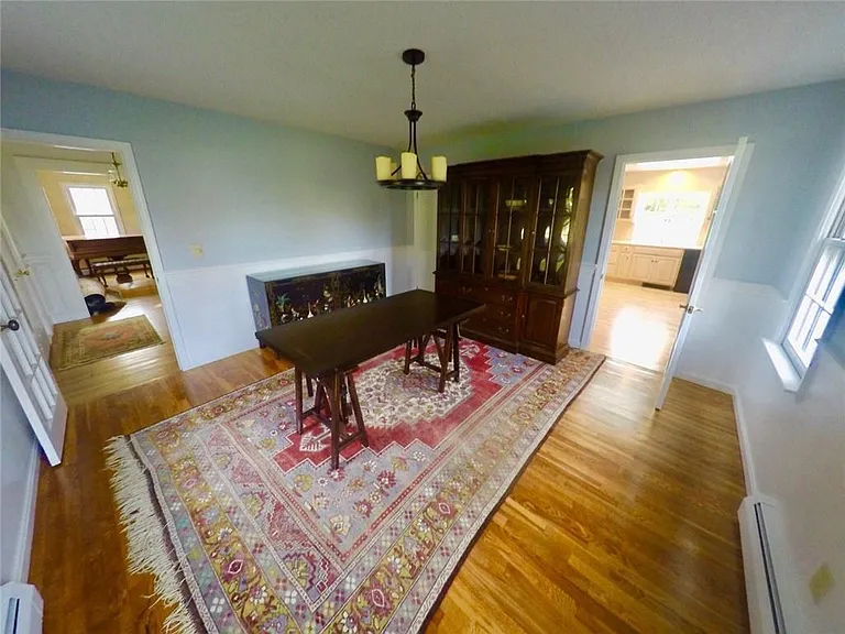Dining room (kitchen to the right, looking at entryway to the left