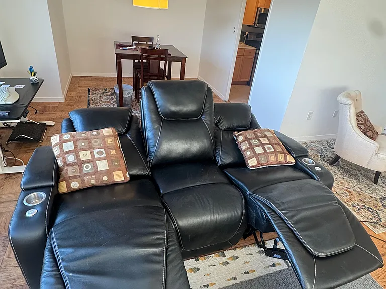 Sofa adjusts to full lounge with adjustable head and lumbar support as well on both ends of the sofa.