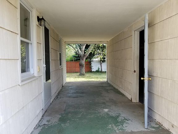 Porch between side entrance and garage