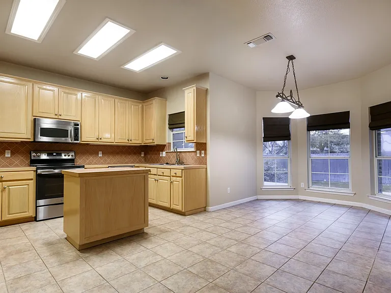 Kitchen and dining are open to the living room.