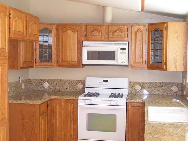 Remodeled Kitchen w/ Granite Counters and Custom Cabinetry
