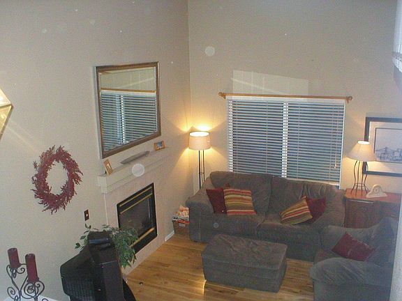 Cozy Living Room with Relaxing Fireplace and Cathedral Ceiling!