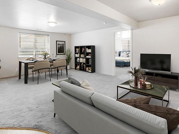 Living room with view into master bedroom