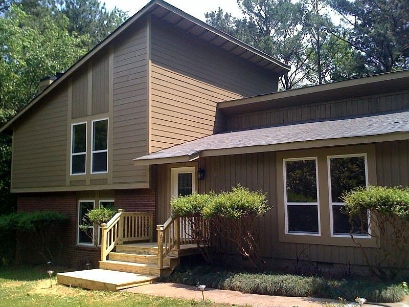 Exterior, new windows, siding, front steps. 