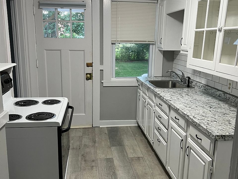 Kitchen: new countertop, backsplash, and flooring