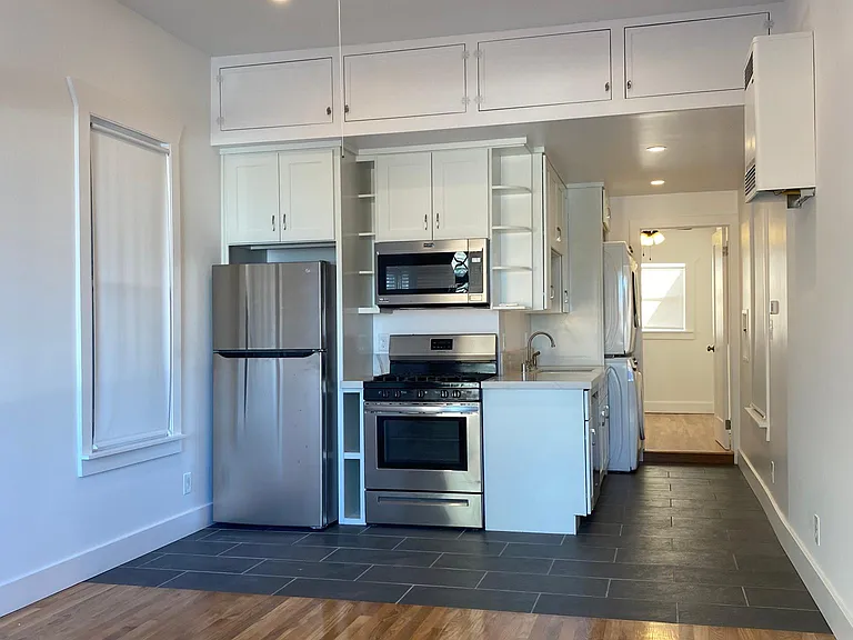 OPEN FLOOR PLAN FROM LIVING ROOM TO KITCHEN FROM FRONT ENTRANCE