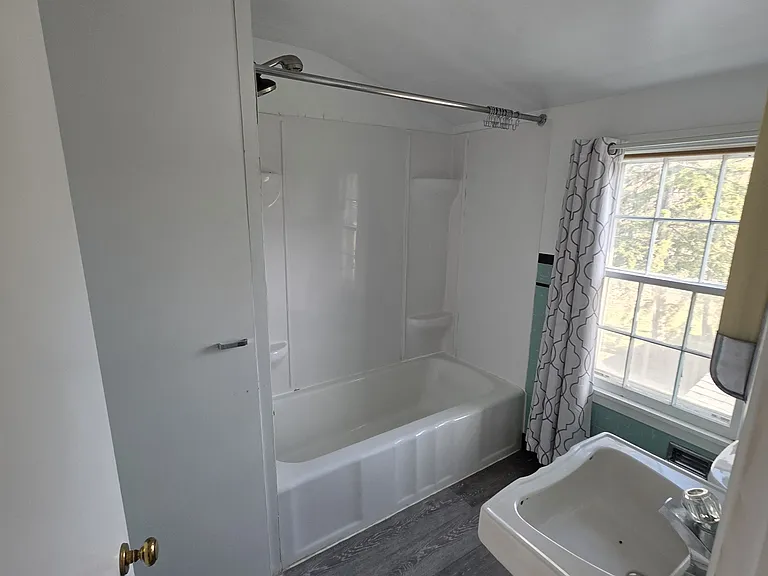 Upstairs bathroom. Spacious linen closet provides great storage.