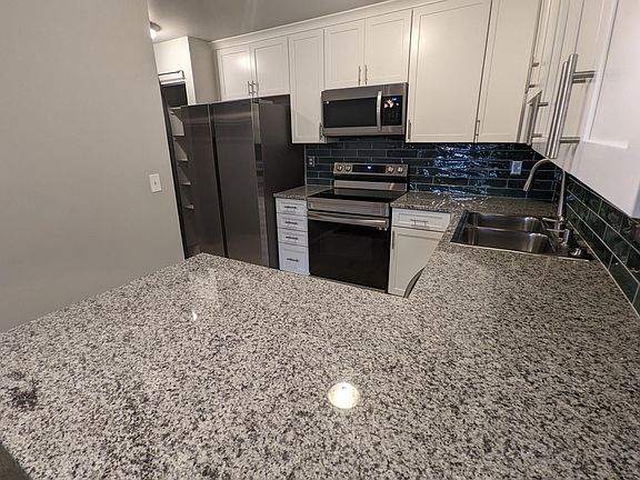Granite Counter Tops! Kitchen is great for entertaining, it opens up to the living room and has mountain views!