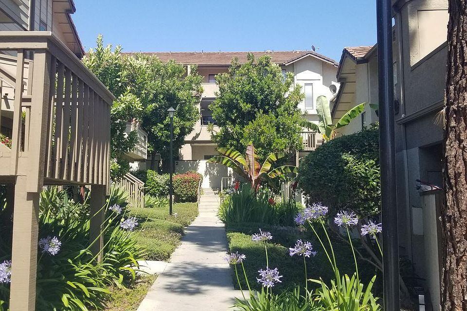 Landscaped entrance to 128 Maegan Place #7. Unit is just up to left