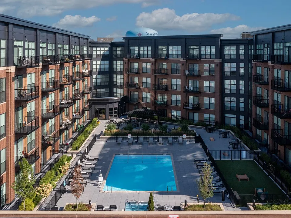 Back side of property showing the surrounding balconies facing the amenity deck.