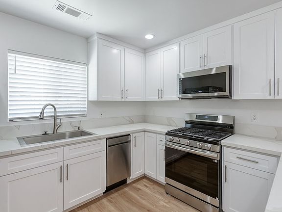 Luxury Kitchen & Appliances, LVP Flooring, Dual Pane Windows.