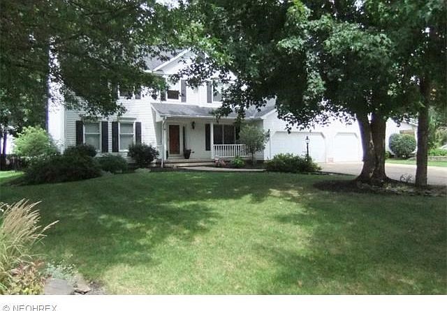 Front View Includes Front Porch And 3 Car Garage.