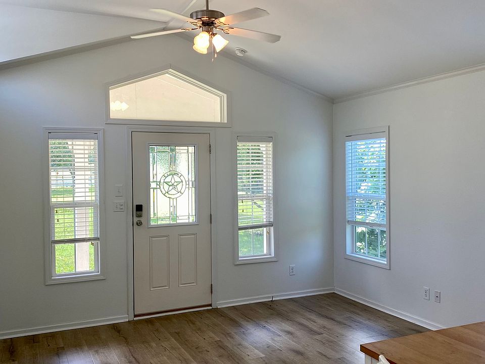 Spacious living room with vaulted ceilings and tons of windows.