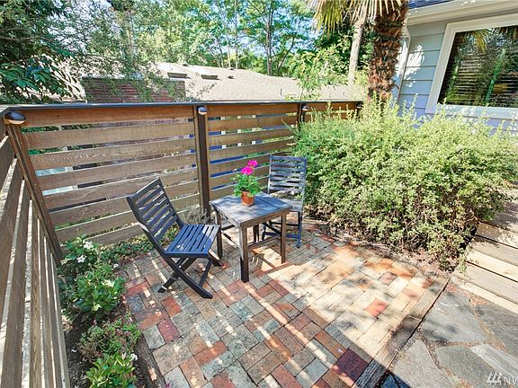 East-facing front deck & patio is the perfect setting for your morning coffee. 