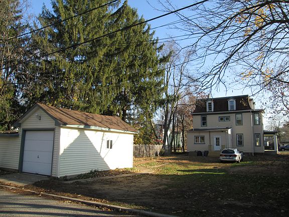 Rear of the property with the detached garage for this unit.