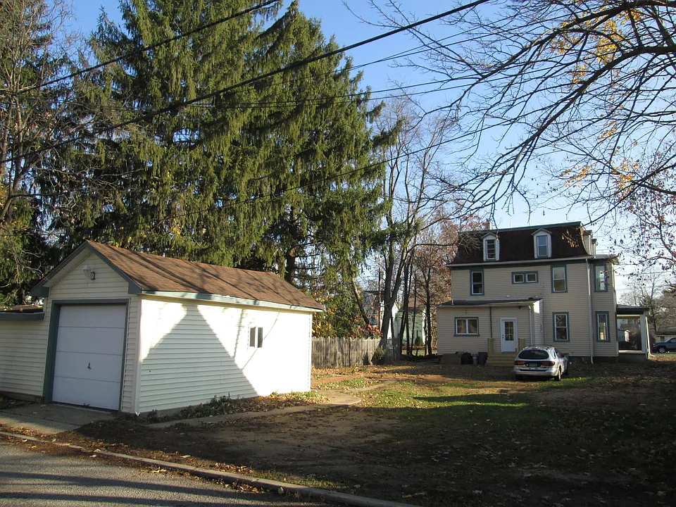 Rear of the property with the detached garage for this unit.