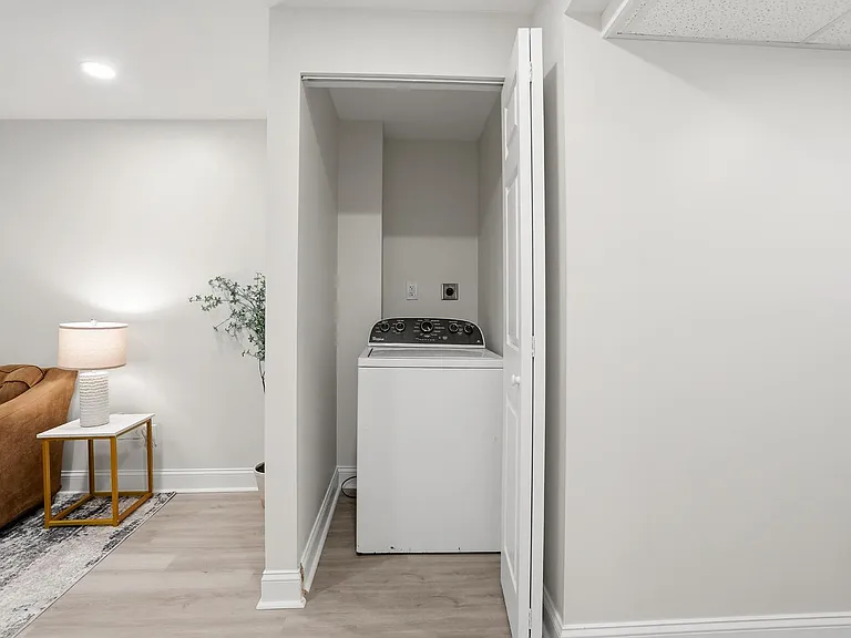 Convenient in-home laundry nook with washer hookup, tucked neatly off the main living area for easy access.