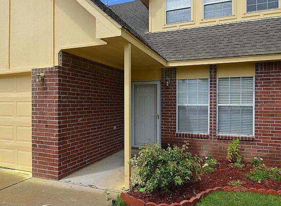 A hint of red bricks by entrance