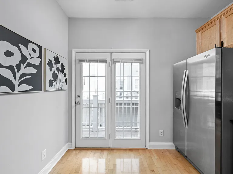 Patio door with Screen leading to patio, which is perfect for morning coffee.