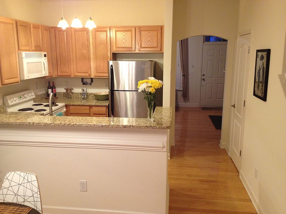 dining room, kitchen, looking into living room downstairs