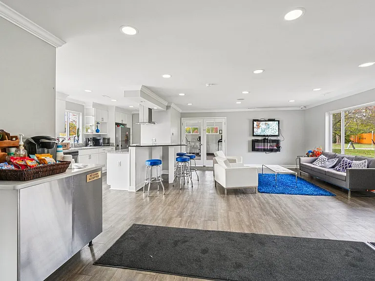 Host gatherings in our open-concept community space featuring full kitchen and dining areas, professionally operated by Highlands Vista Group
