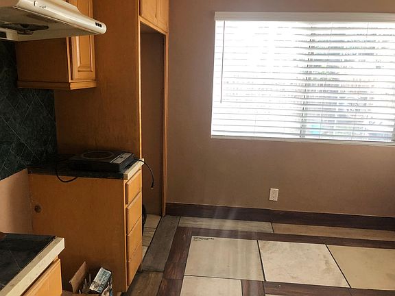 Space is reserved for stove and refrigerator in the kitchen.