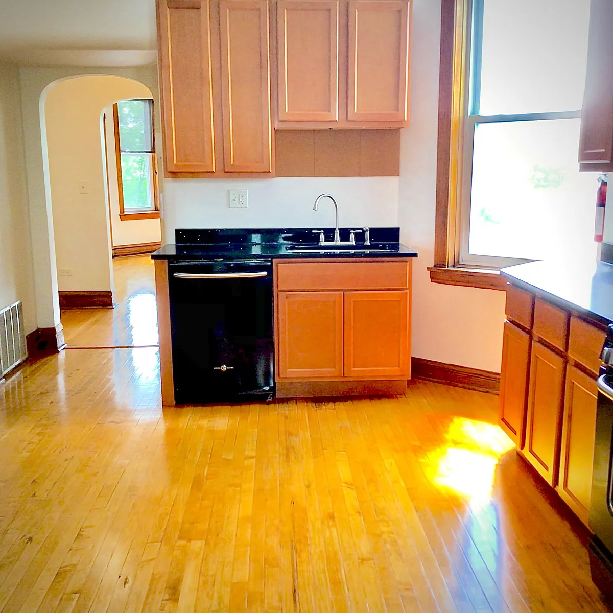 Spacious kitchen includes vintage woodwork and modern appliances. - 2318 S Marshall Blvd