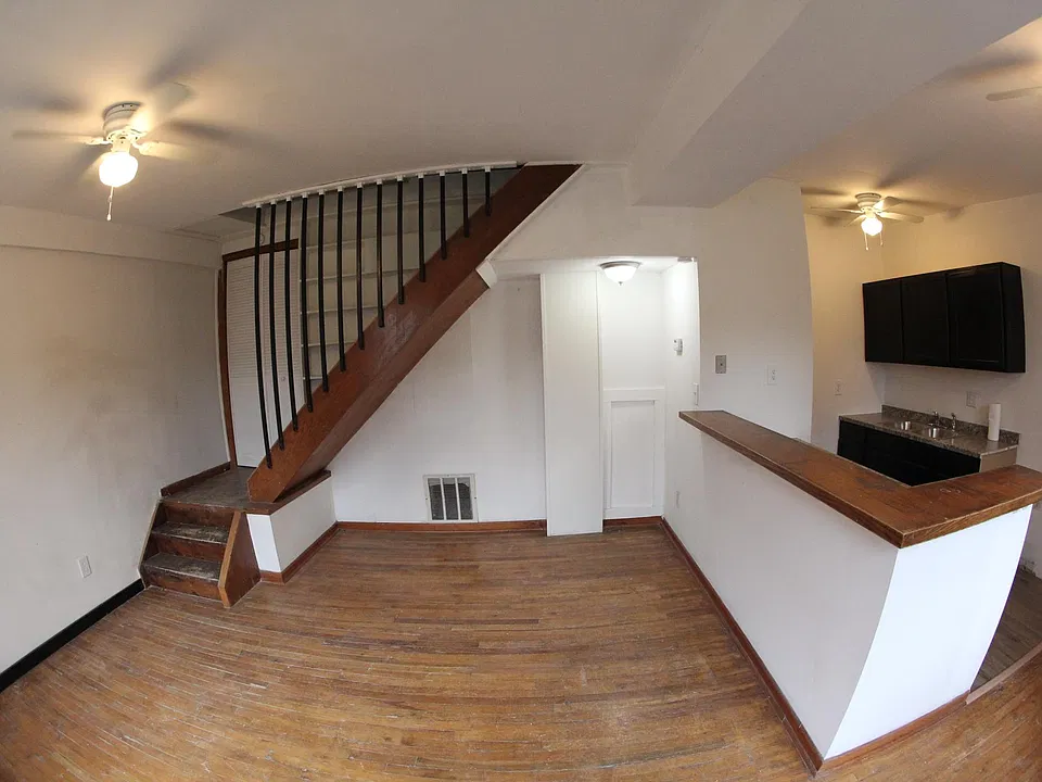 This is the view when you first enter the apartment. A newly remodeled kitchen sits to your right and the rest of the room is a spacious, open living area which can be a dining room or a living room and with a smaller dining area.