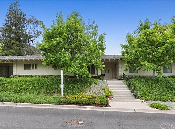 Beautiful trees surrounding front exterior