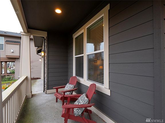 Relax on the covered front patio and watch the world pass by. 