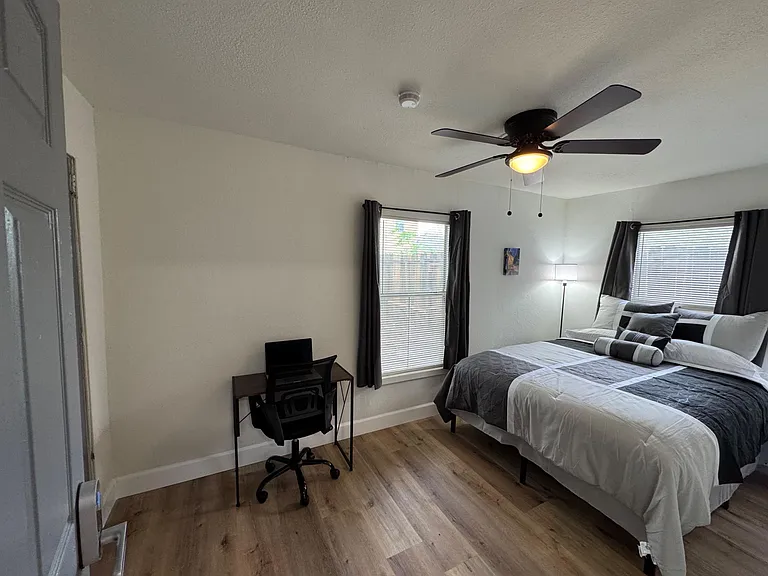 Lots of light with two windows and yet mini blinds and black out curtains. Very secluded part at back of house.