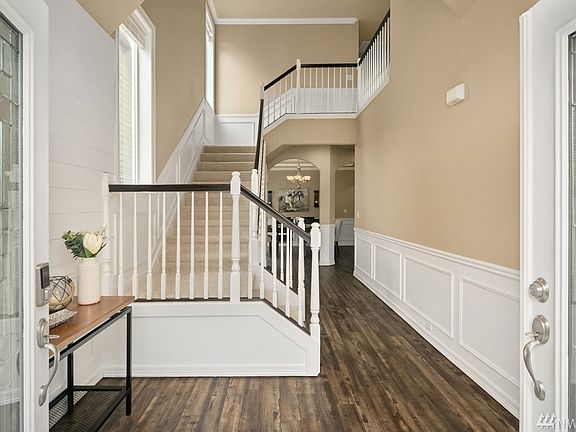 Talk about a dramatic entrance! Luxury vinyl plank flooring, decorative wood trim, and crown molding greet you as you open the front doors.