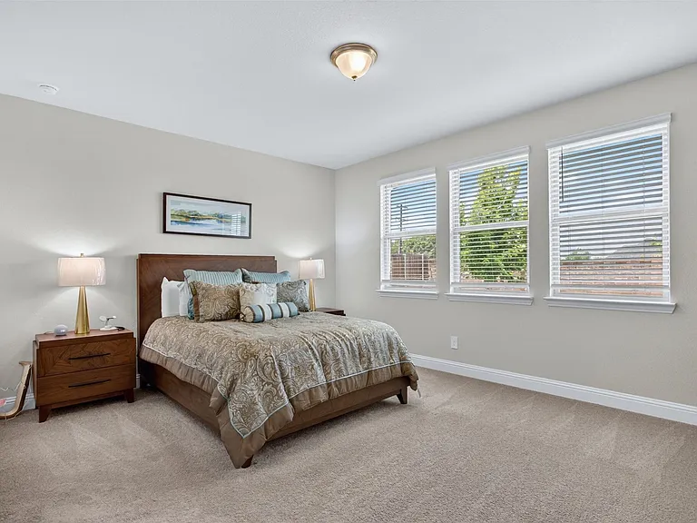 Spacious room featuring neutral carpeting and light-toned walls
