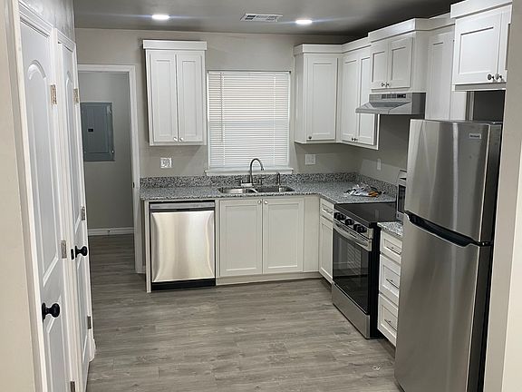 The kitchen has custom made cabinets, several storage spaces and a pantry closet. All appliances seen in the picture included.