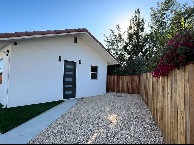 Main entrance with 8' tall door.