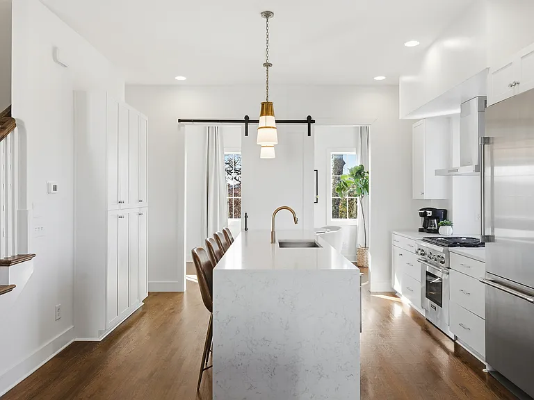 Fully equipped kitchen with stainless steel appliances, seating for 4 at the kitchen island, additional seating at the dining room table and all the dishware / utensils you might need.