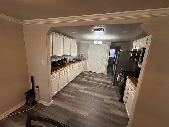 Open area from dining to kitchen.
