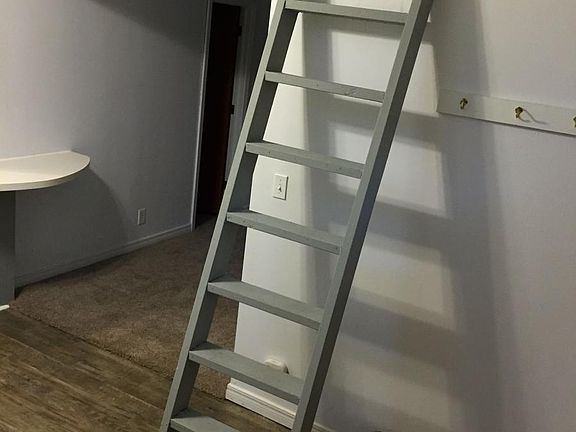 Lofted living and entertainment area off kitchen.
