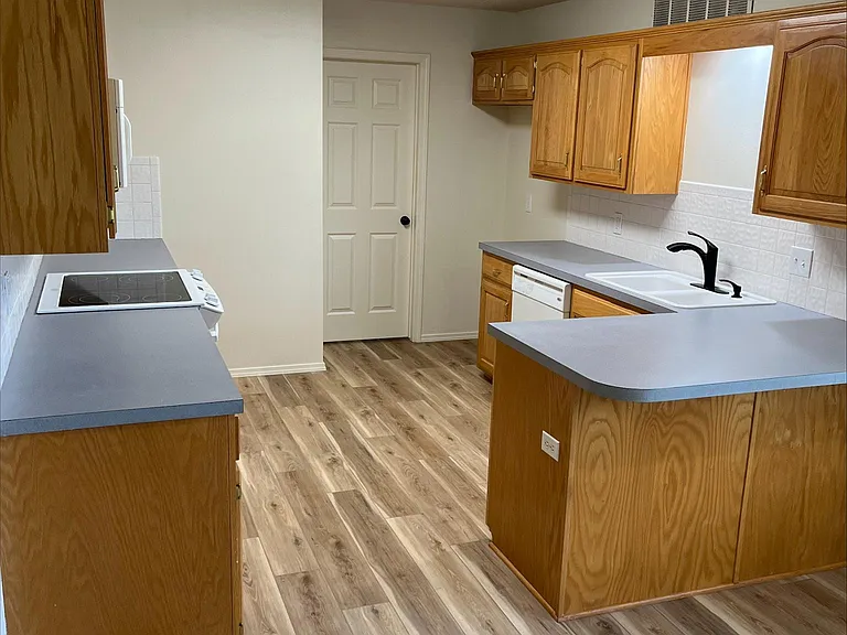 Kitchen with door to laundry room